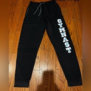Jerzees Black Sweatpants with gymnast on the leg. Size medium